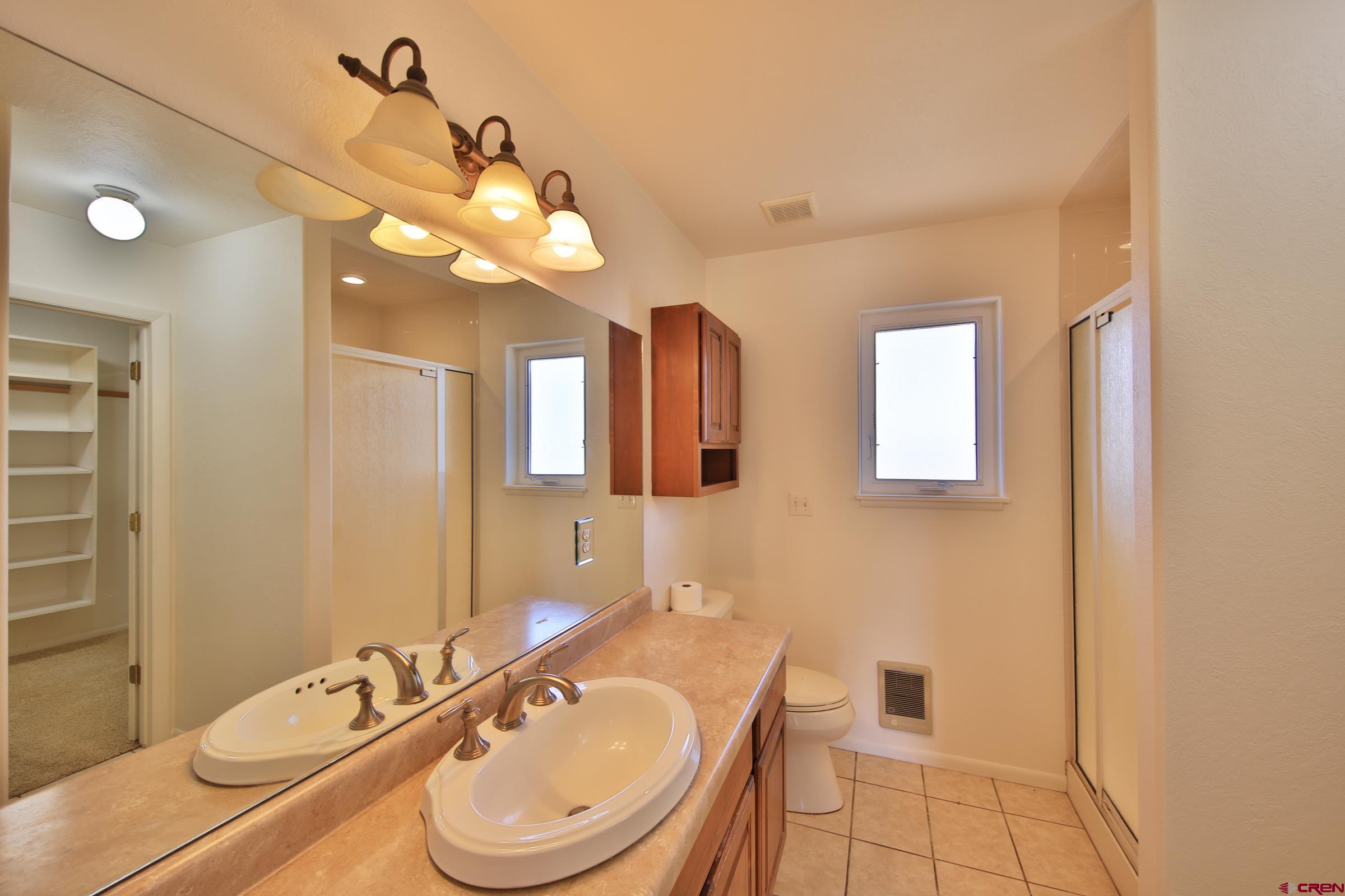 13637 Happy Hollow Road Eckert, CO 81418 - Photo 21 of 38 a bathroom with a bathtub a sink and a mirror