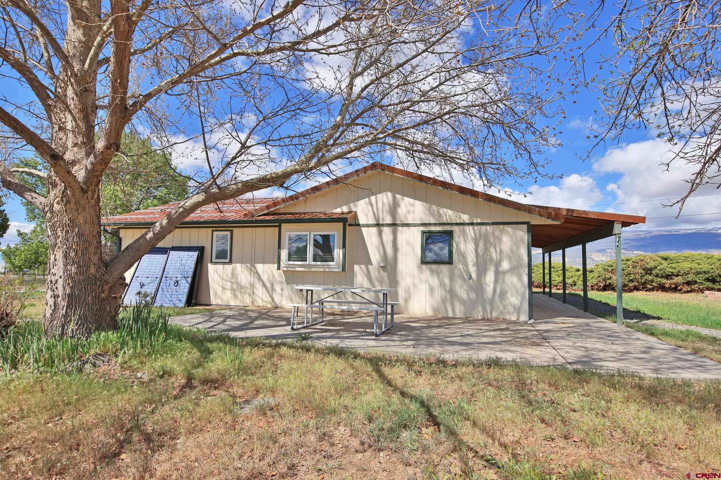 13637 Happy Hollow Road Eckert, CO 81418 - Photo 22 of 38 a front view of a house with a yard
