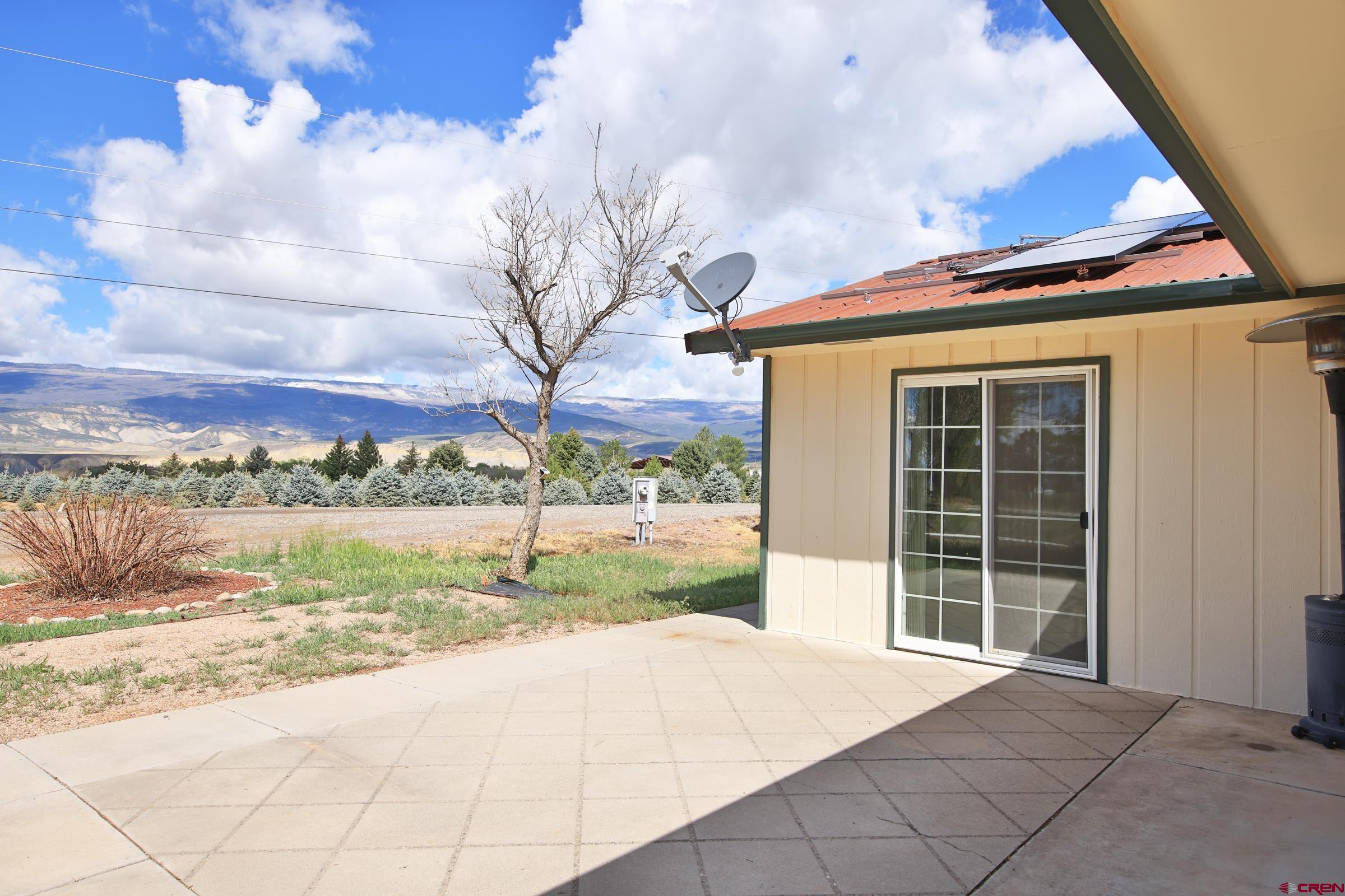 13637 Happy Hollow Road Eckert, CO 81418 - Photo 24 of 38 a view of a house with a yard