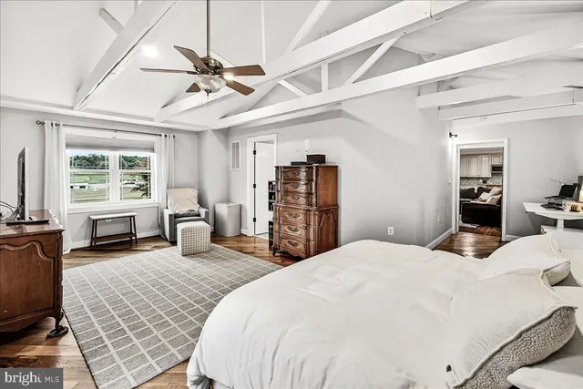 a white toilet sitting next to a shower curtain