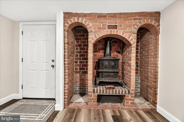 a front view of house with yard and outdoor seating