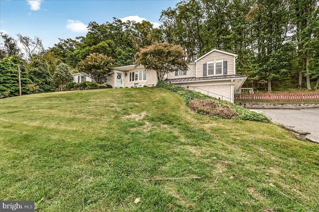 a view of a street with benches in the background