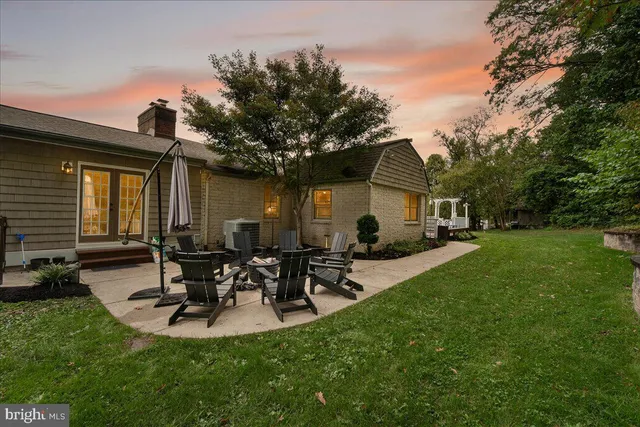a view of a swimming pool with outdoor seating