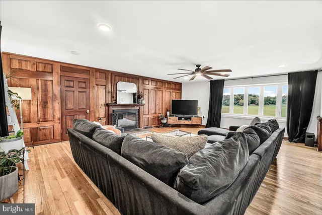 a kitchen with stainless steel appliances a stove cabinets and wooden floor