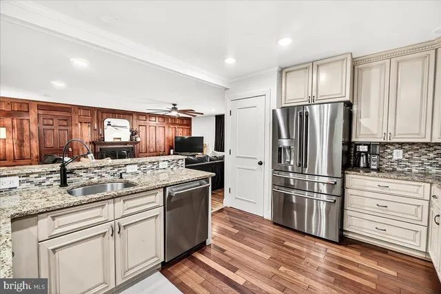 a bedroom with a bed computer and a desk