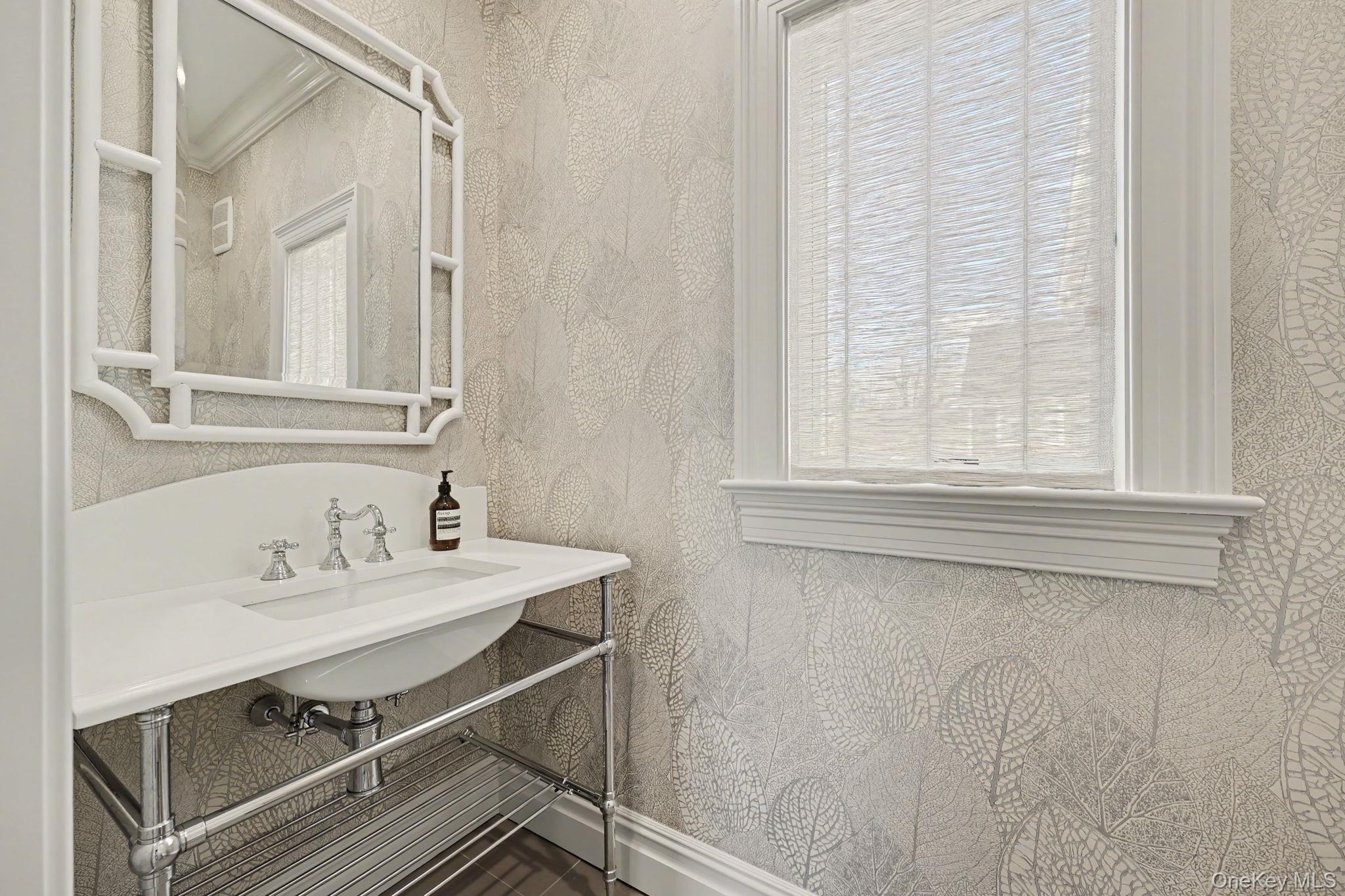 30 Wainwright Street Rye, NY 10580 - Photo 15 of 37 a bathroom with a sink and a mirror