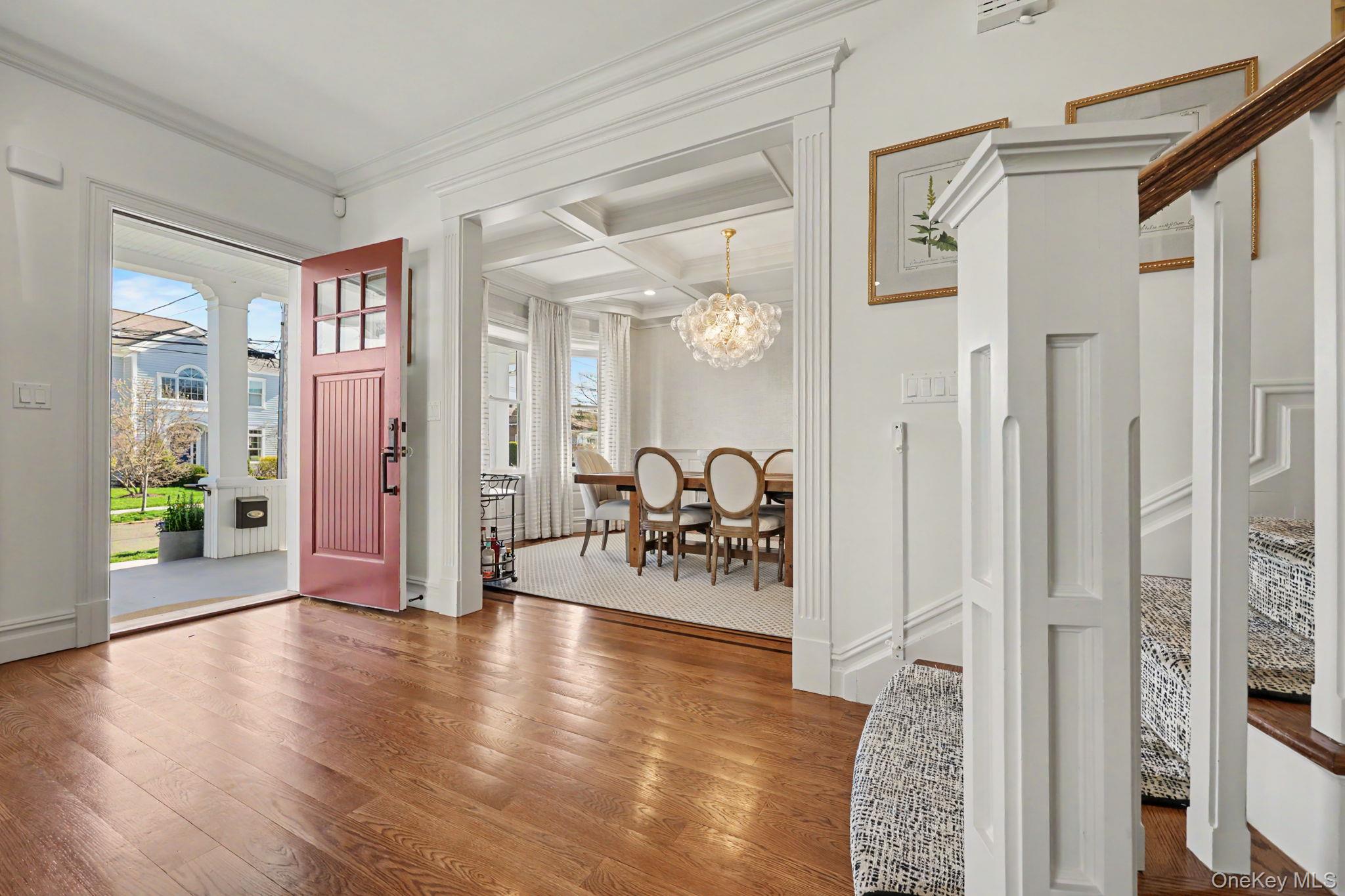 30 Wainwright Street Rye, NY 10580 - Photo 2 of 37 a view of a hallway with wooden floor and a living room