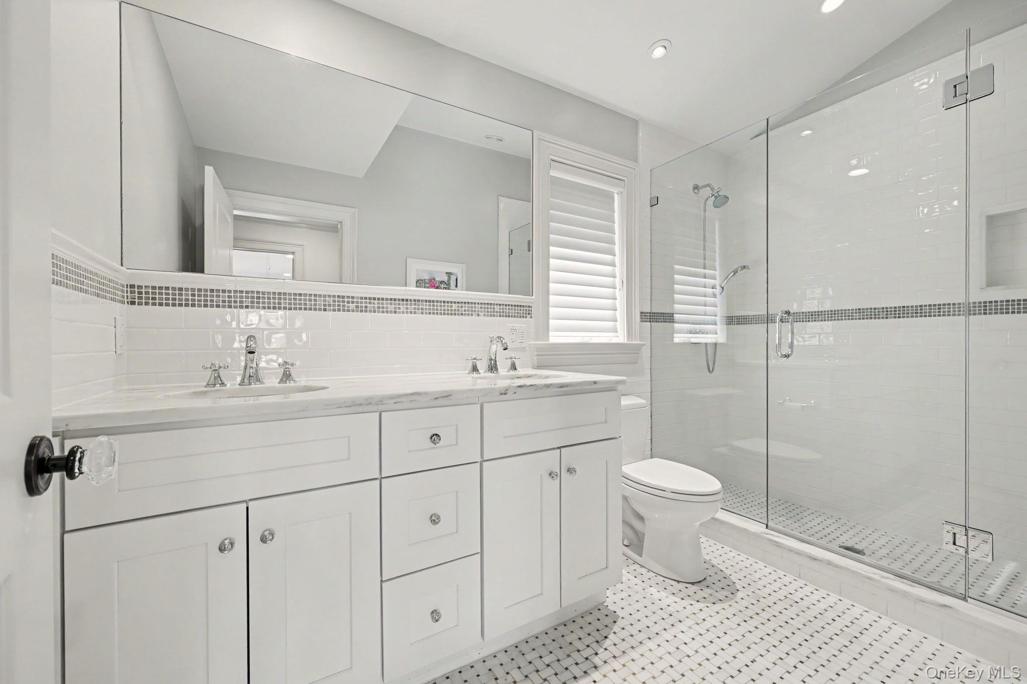 30 Wainwright Street Rye, NY 10580 - Photo 22 of 37 a bathroom with a double vanity sink toilet and shower