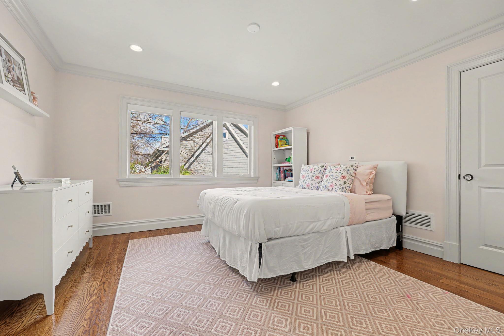 30 Wainwright Street Rye, NY 10580 - Photo 23 of 37 a spacious bedroom with a bed and a large window