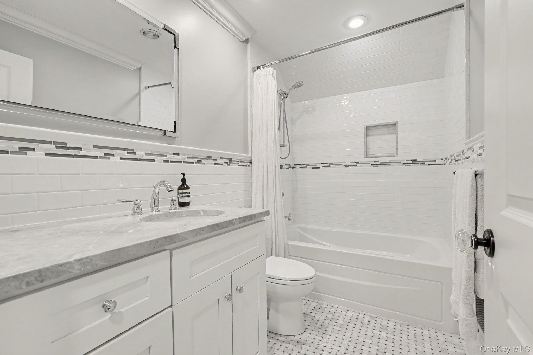 30 Wainwright Street Rye, NY 10580 - Photo 25 of 37 a bathroom with a granite countertop sink a toilet and shower