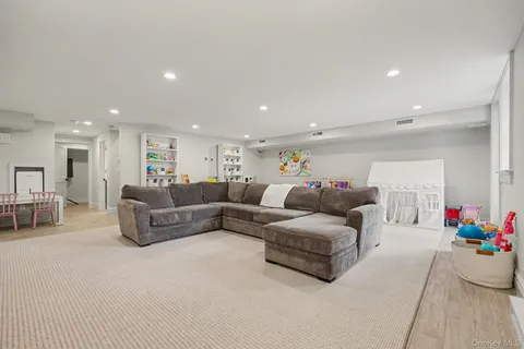 a living room with furniture and flowers