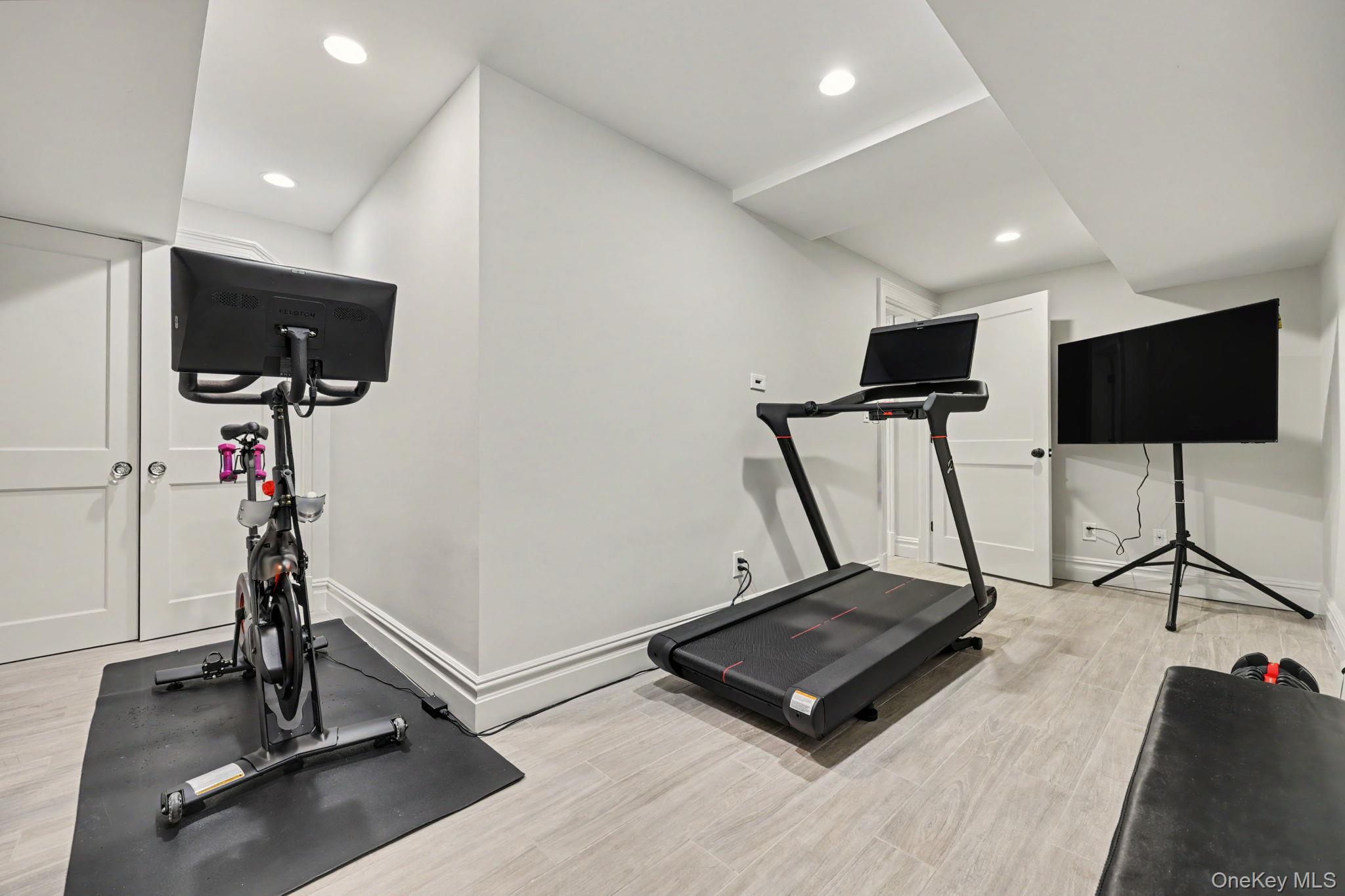 30 Wainwright Street Rye, NY 10580 - Photo 28 of 37 a room with gym equipment and a flat screen tv