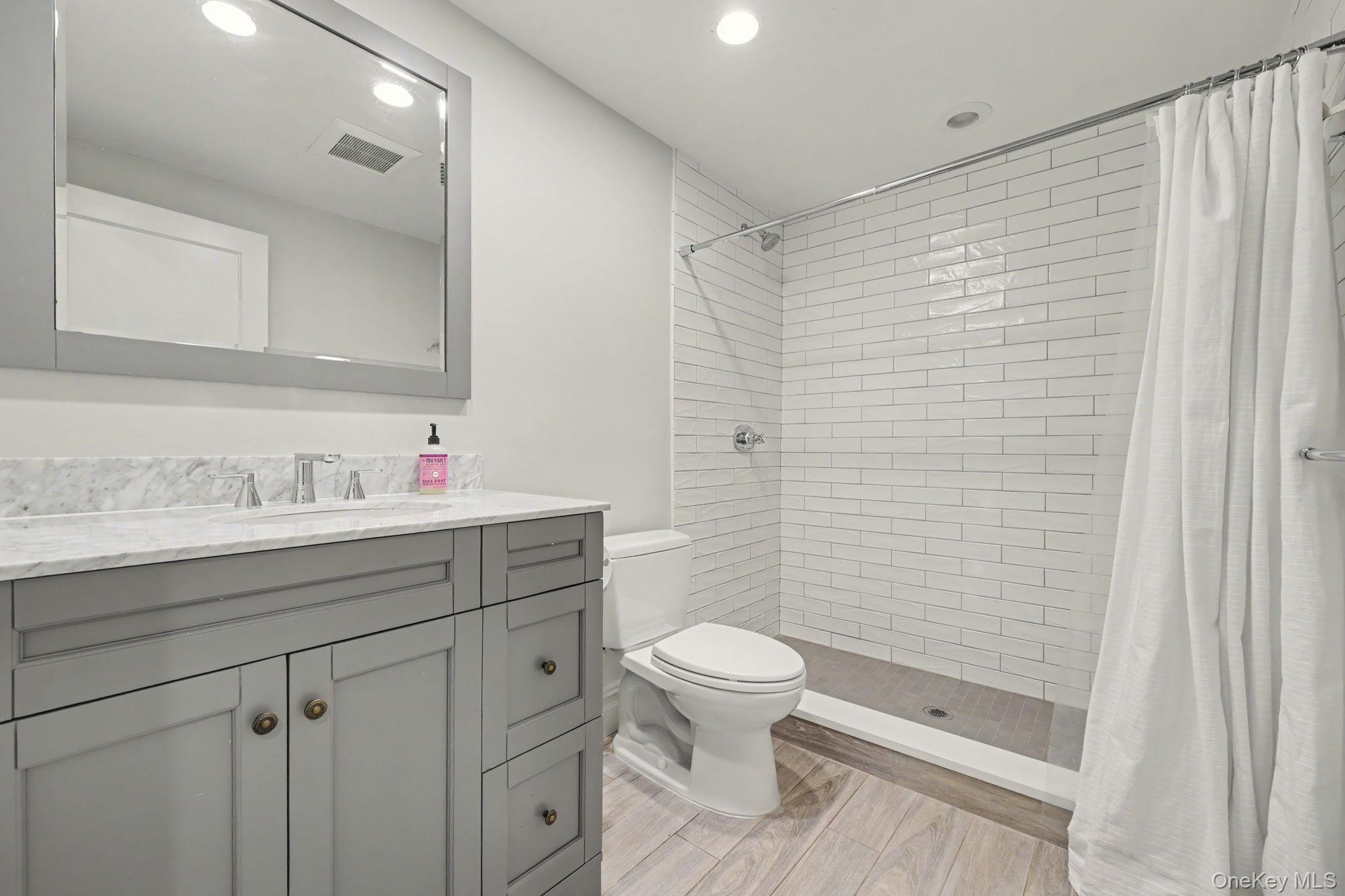 30 Wainwright Street Rye, NY 10580 - Photo 29 of 37 a bathroom with a sink a toilet and shower