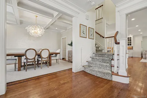 a view of a livingroom kitchen and dinning room with wooden floor