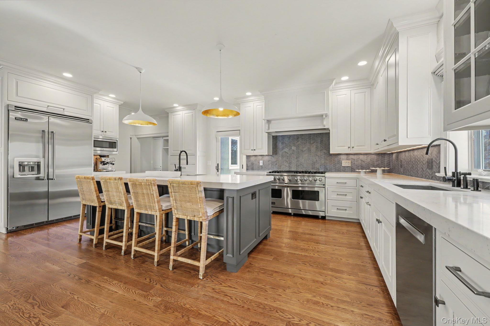 30 Wainwright Street Rye, NY 10580 - Photo 7 of 37 a large kitchen with a center island and stainless steel appliances