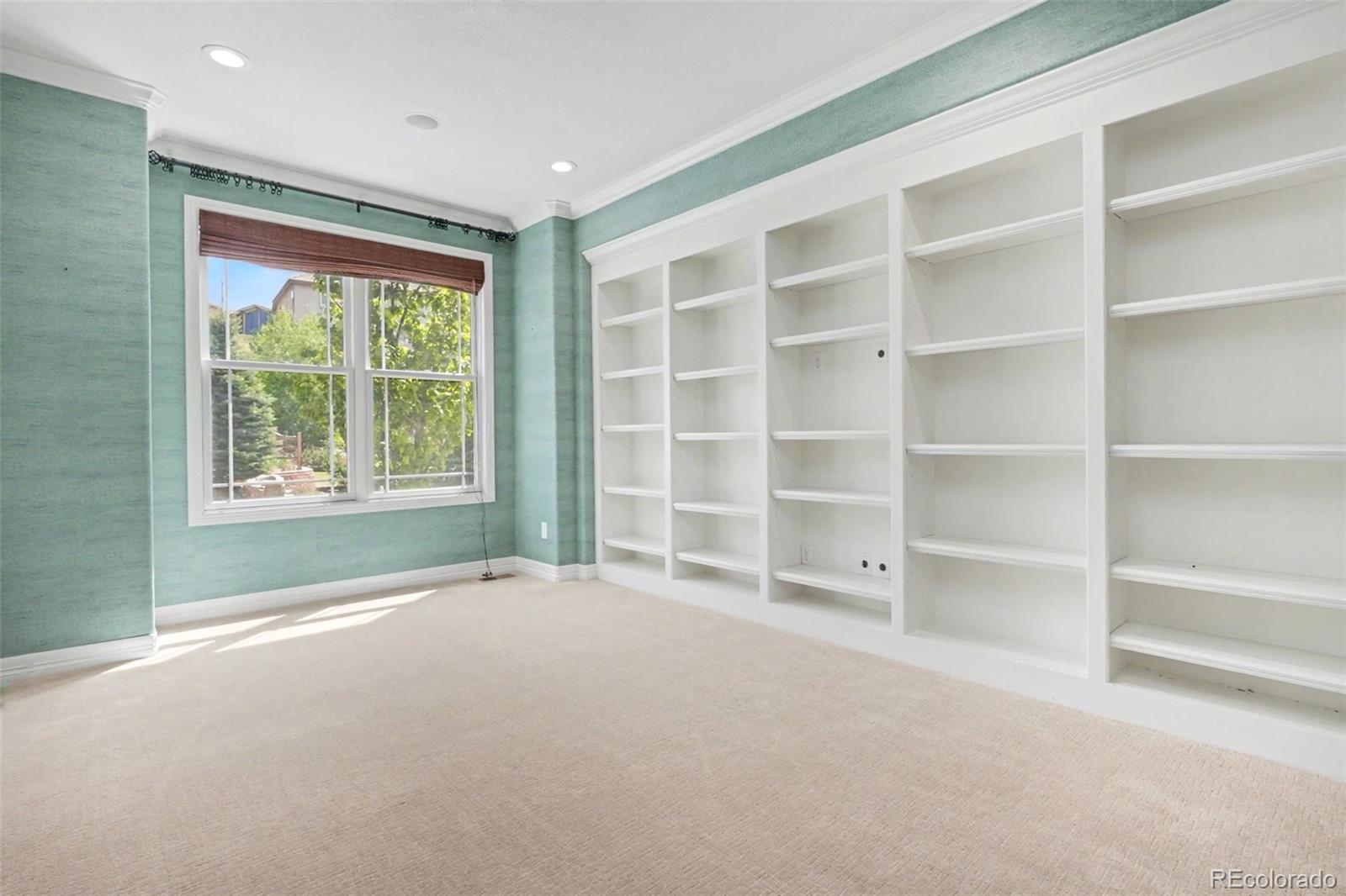 791 Elk Rest Road Evergreen, CO 80439 - Photo 19 of 46 a view of an empty room with a window and cabinet