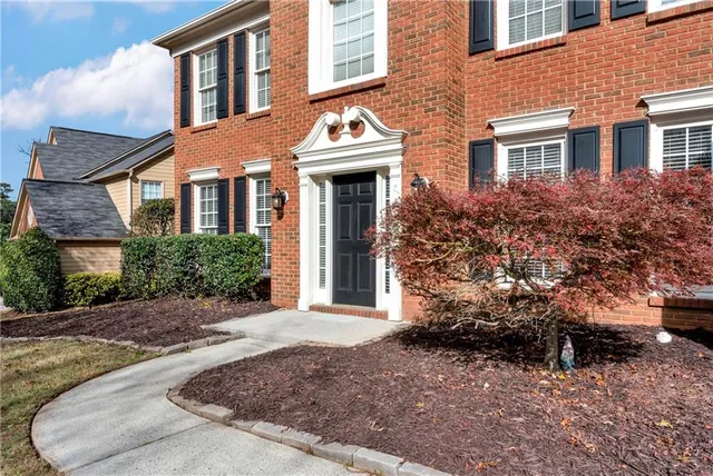 a view of an entryway with wooden floor and door