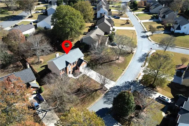 an aerial view of residential houses and outdoor space
