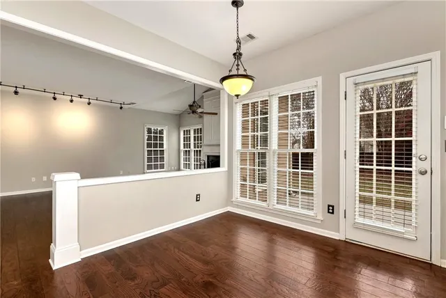 a kitchen with stainless steel appliances granite countertop a sink and refrigerator