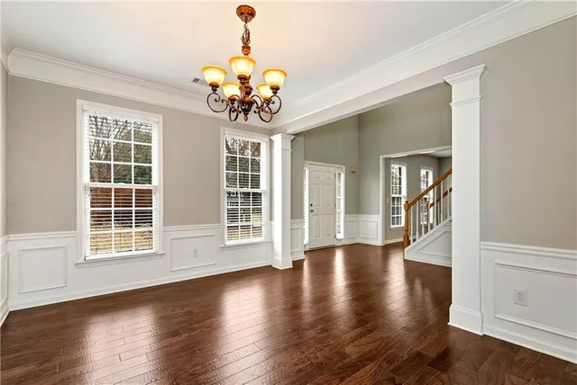 a view of a hallway with chandelier