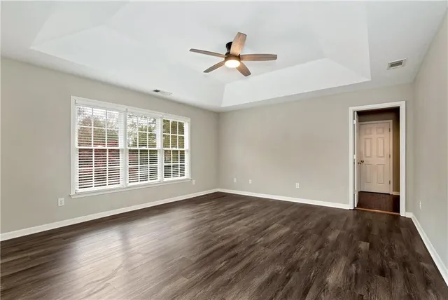 a bathroom with a tub a sink and a shower