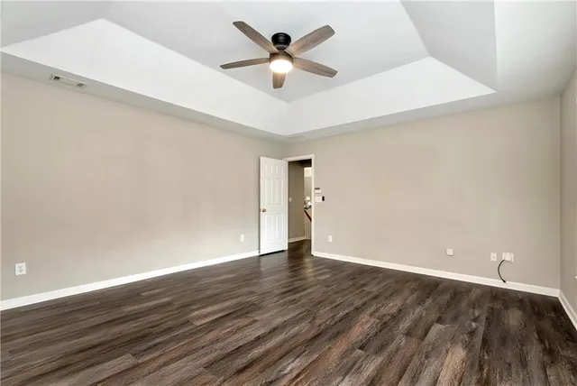 a white bath tub sitting in a en suite bathroom