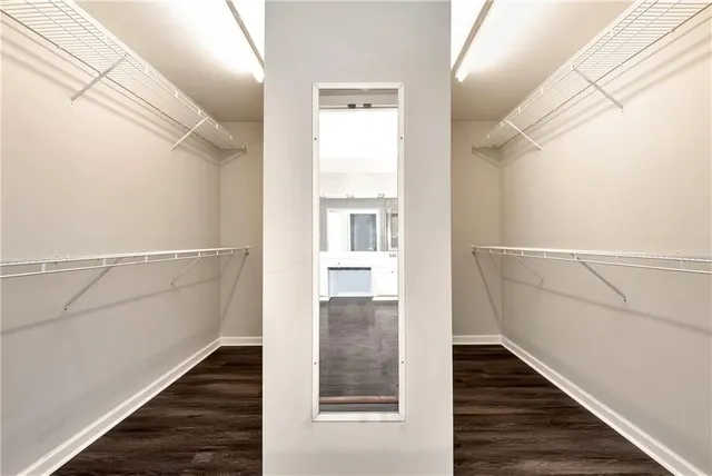 a bathroom with a double vanity sink toilet mirror and shower