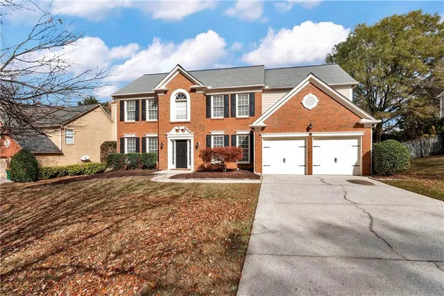 a view of road with large trees