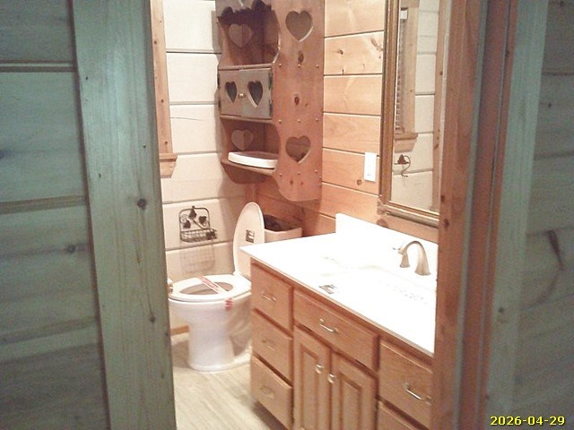 81 Brady Road Buena Vista, GA 31803 - Photo 11 of 26 a bathroom with a granite countertop toilet and a sink