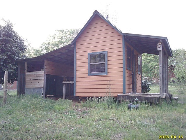 81 Brady Road Buena Vista, GA 31803 - Photo 20 of 26 a view of a house with a backyard