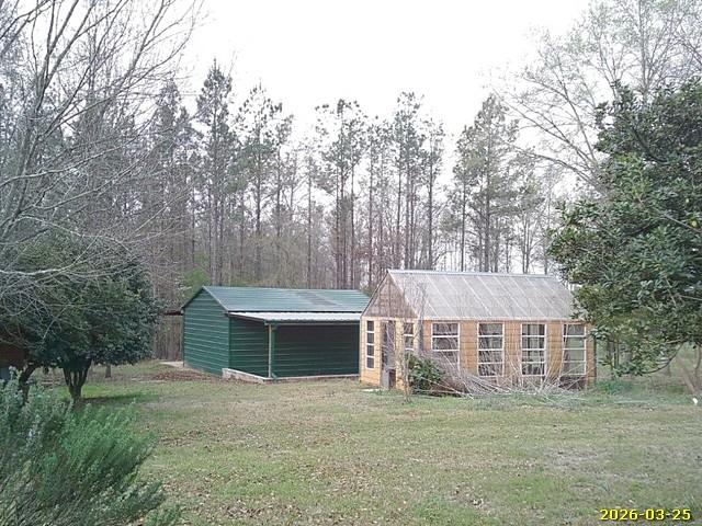 81 Brady Road Buena Vista, GA 31803 - Photo 24 of 26 a view of a house with a yard