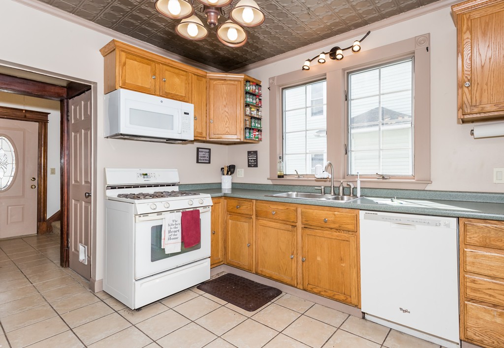 82 Dwight Road Springfield, MA 01108 - Photo 14 of 28 a kitchen with stainless steel appliances granite countertop a stove a sink and a refrigerator