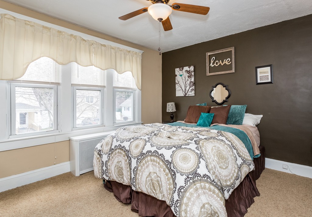 82 Dwight Road Springfield, MA 01108 - Photo 18 of 28 a bedroom with a large bed and a window