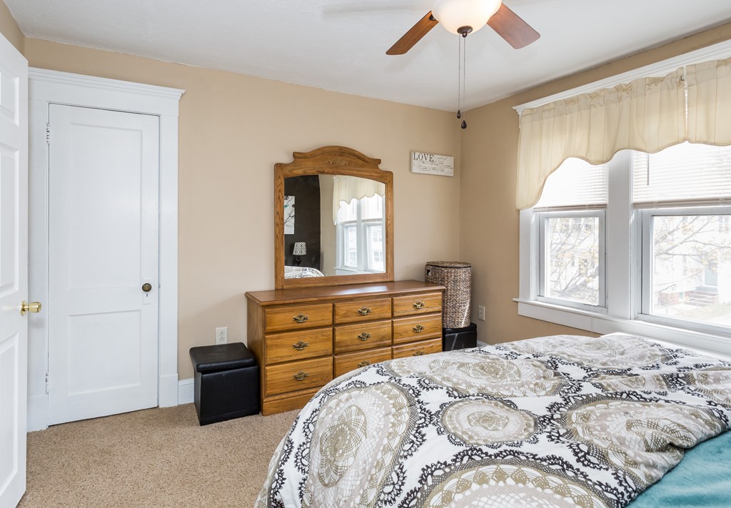 82 Dwight Road Springfield, MA 01108 - Photo 19 of 28 a bedroom with a bed and a dresser