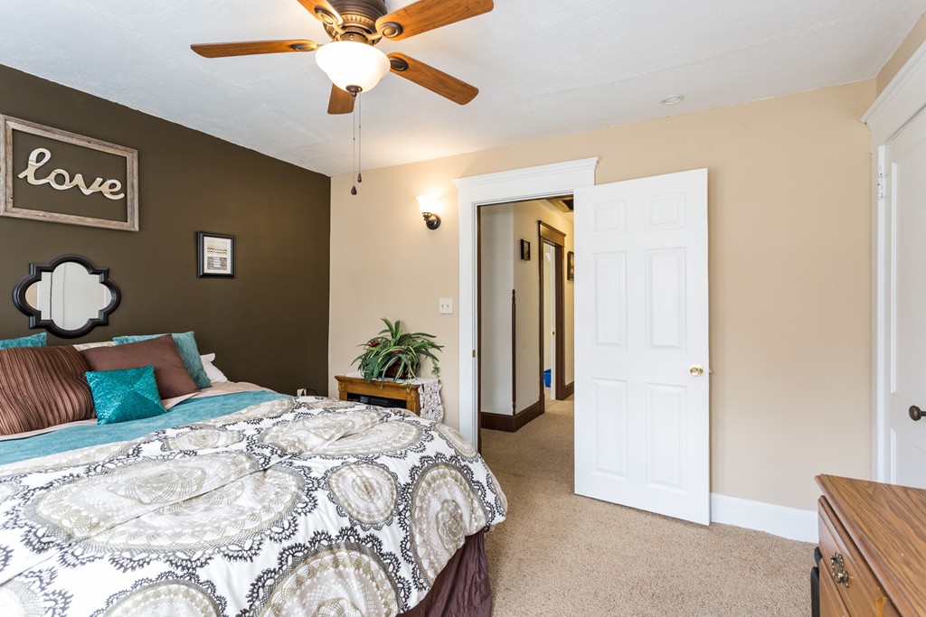 82 Dwight Road Springfield, MA 01108 - Photo 20 of 28 a bedroom with a bed and a chandelier