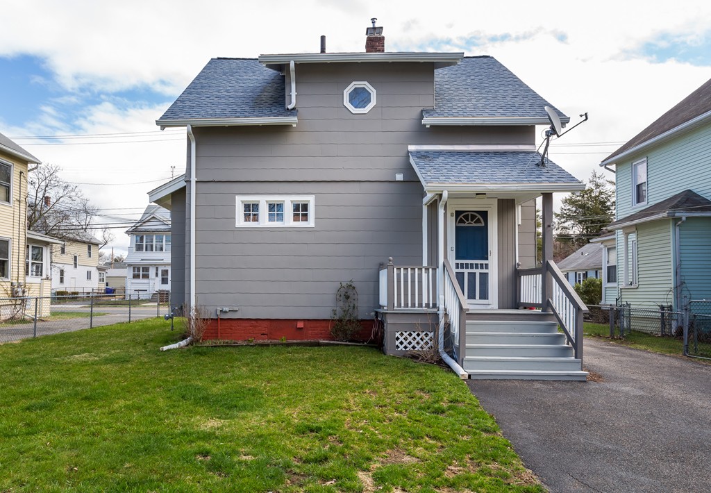 82 Dwight Road Springfield, MA 01108 - Photo 2 of 28 a front view of a house with garden