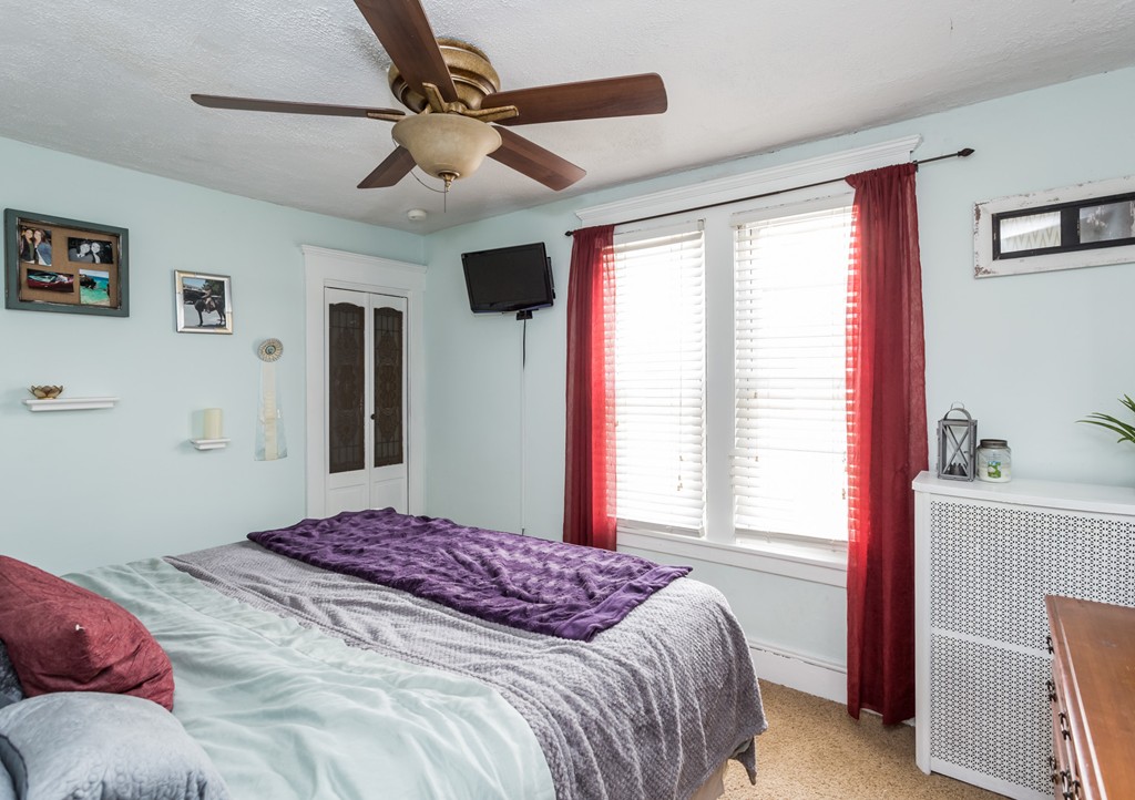 82 Dwight Road Springfield, MA 01108 - Photo 21 of 28 a bedroom with a bed dresser and a window