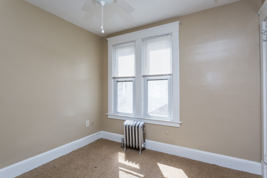 82 Dwight Road Springfield, MA 01108 - Photo 23 of 28 a view of an empty room with a window