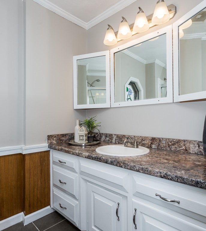82 Dwight Road Springfield, MA 01108 - Photo 26 of 28 a bathroom with a granite countertop sink and a mirror