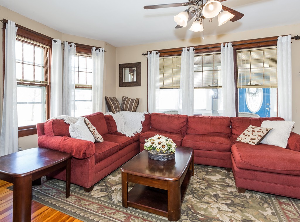 82 Dwight Road Springfield, MA 01108 - Photo 7 of 28 a living room with furniture large windows and wooden floor