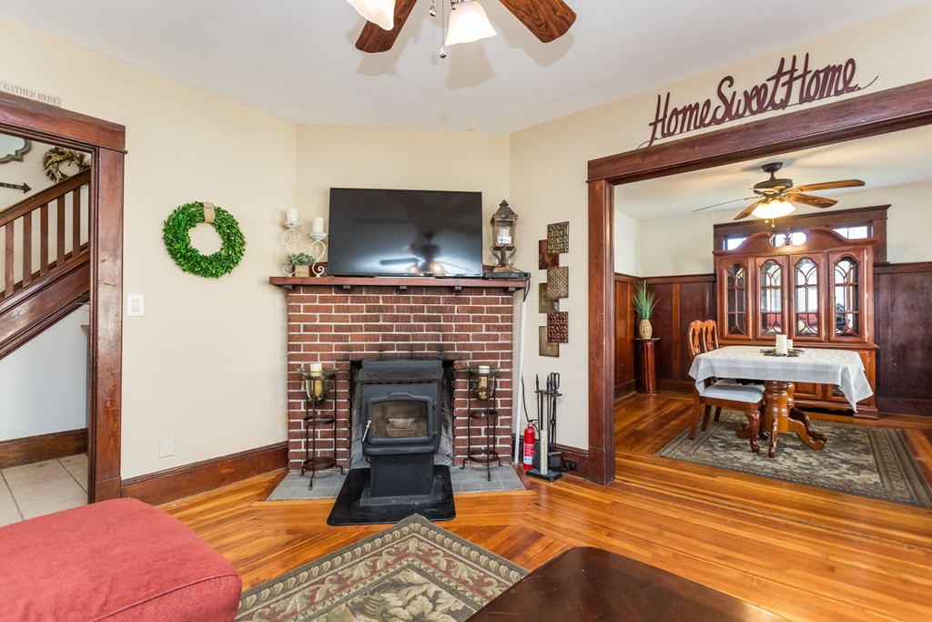 82 Dwight Road Springfield, MA 01108 - Photo 9 of 28 a living room with furniture and a fireplace