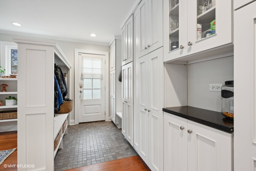 807 Cherry Street Winnetka, IL 60093 - Photo 12 of 37 a view of hallway with stairs and wooden floor