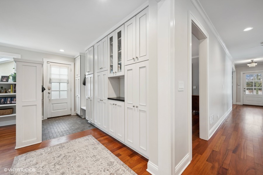 807 Cherry Street Winnetka, IL 60093 - Photo 13 of 37 a view of a kitchen with white cabinets and wooden floor