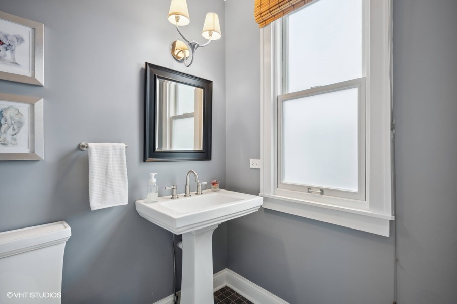 807 Cherry Street Winnetka, IL 60093 - Photo 14 of 37 a bathroom with a sink a mirror and a toilet