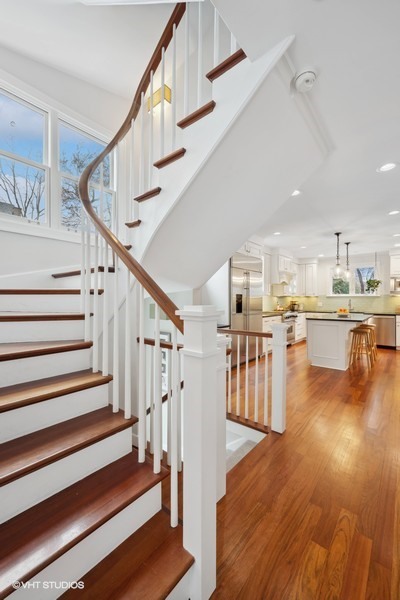 807 Cherry Street Winnetka, IL 60093 - Photo 15 of 37 a view of staircase and kitchen with wooden floor