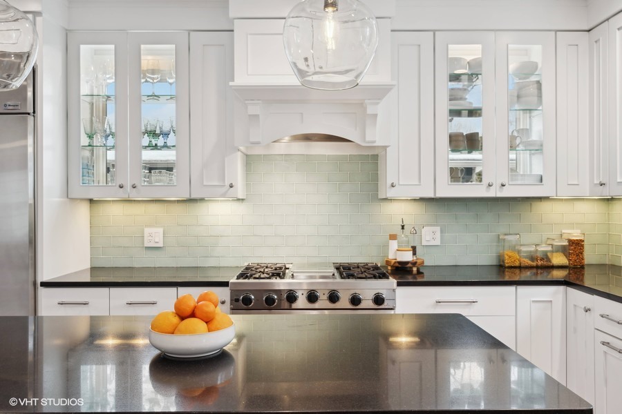 807 Cherry Street Winnetka, IL 60093 - Photo 8 of 37 a kitchen with a stove a microwave and cabinets