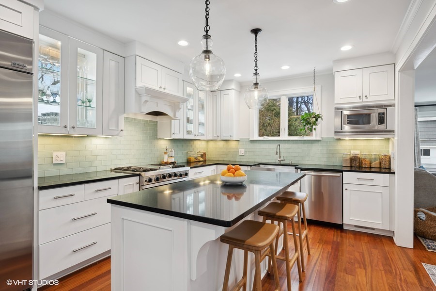 807 Cherry Street Winnetka, IL 60093 - Photo 9 of 37 a kitchen with stainless steel appliances granite countertop a sink stove and refrigerator