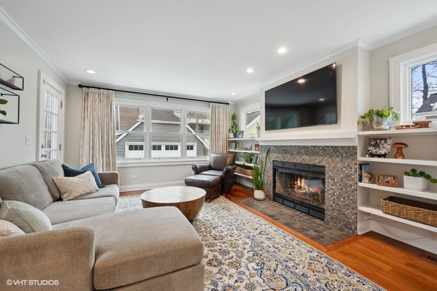 807 Cherry Street Winnetka, IL 60093 - Photo 10 of 37 a living room with furniture a flat screen tv and a fireplace