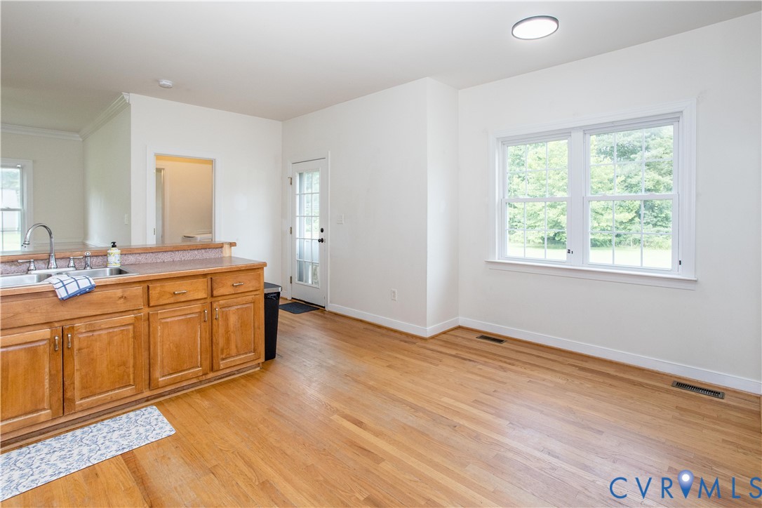 20411 Horseshoe Road Carson, VA 23830 - Photo 19 of 35 Open-concept kitchen and dining area featuring woo