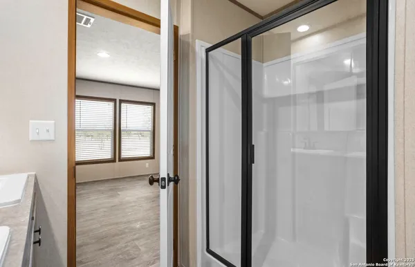 a view of a bathroom with a glass door